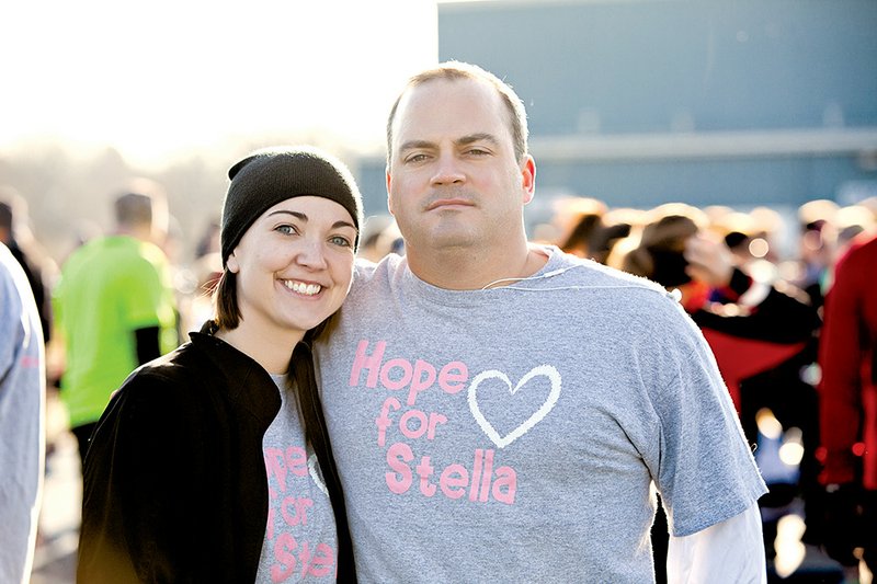Amanda and Travis Mulhearn of Conway are shown at last year’s Freezin’ for a Reason 5K, 10K and 2K fun run. It was Amanda’s idea to start the race in memory of her daughters and as a way to give back to Arkansas Children’s Hospital. For more information or to register, visit www.freezinforareason.org.