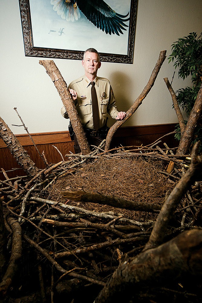 Jason Parrie is the head park interpreter at DeGray Lake Resort State Park near Bismarck. Here, Parrie, a Louisiana native, stands behind an exhibit at the park that replicates the nest of an American bald eagle. Parrie has worked at the park since 2004.