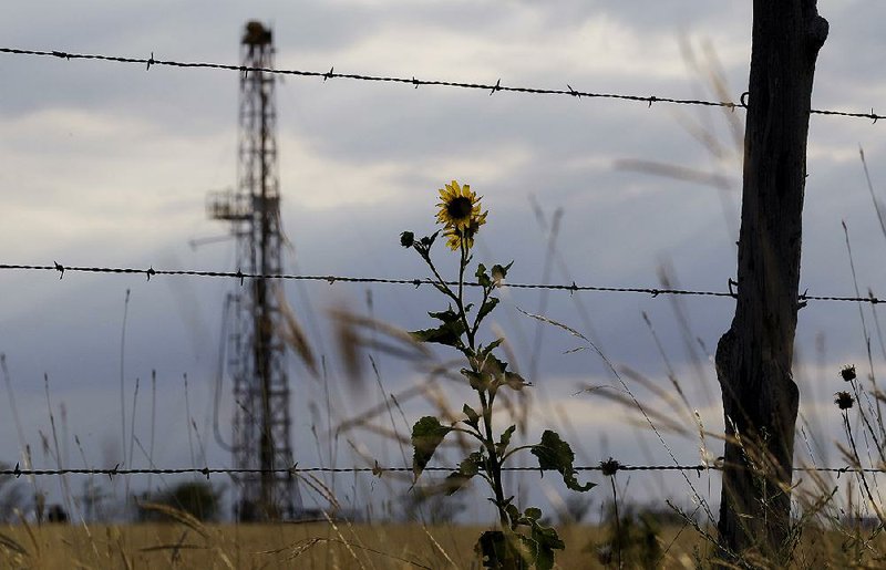 Expanded U.S. oil exploration, such as this drilling rig near Kennedy, Texas, is causing some oil companies to push for permission to export some of the crude oil that is being produced in greater volumes domestically. 