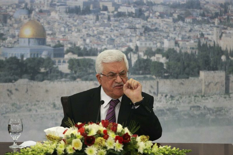 Palestinian President Mahmoud Abbas speaks during a meeting at his compound in the West Bank city of Ramallah, Saturday, Jan. 11, 2014. (AP Photo/Majdi Mohammed)