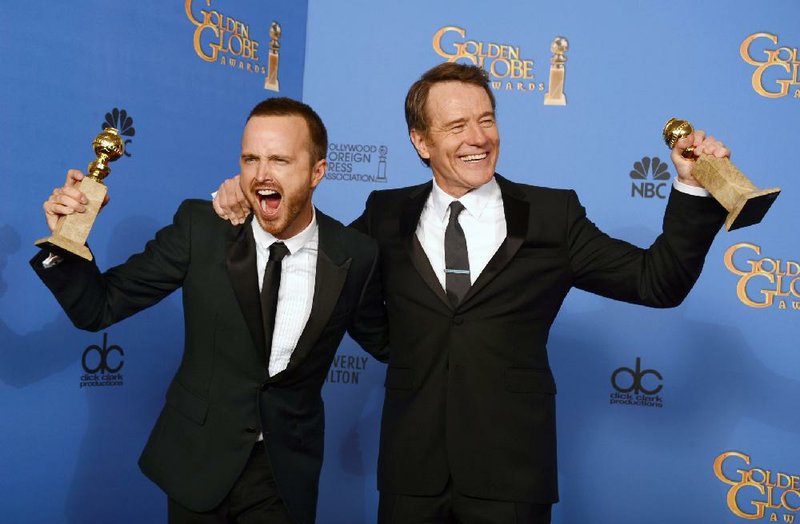 Aaron Paul, left, and Bryan Cranston pose in the press room with the award for best TV series - drama for "Breaking Bad" at the 71st annual Golden Globe Awards at the Beverly Hilton Hotel on Sunday, Jan. 12, 2014, in Beverly Hills, Calif. (Photo by Jordan Strauss/Invision/AP)