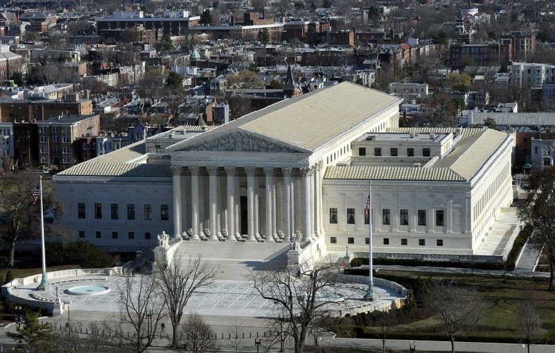 FILE - In this Dec. 19, 2013 file photo, a view of the Supreme Court can be seen from the view from near the top of the Capitol Dome on Capitol Hill in Washington. The Supreme Court hears arguments Monday in a clash between President Obama and Senate Republicans over the power granted the president in the Constitution to make temporary appointments to fill high-level positions.   (AP Photo/Susan Walsh)