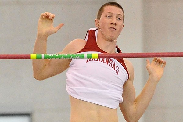 Arkansas jumper Andrew Irwin clears the bar on one of his attempts in the pole vault during the Arkansas Invitational indoor track meet Friday afternoon at the Randal Tyson Track Complex in Fayetteville. Irwin finished in first place with a jump of 5.05m.