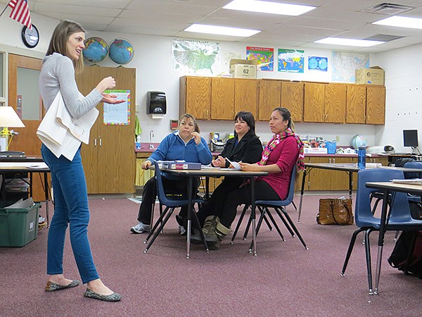 FILE PHOTO ERIN SPANDORF 
Sarah Beers, Family Literacy Program teacher, instructs program participants Maria Pantoja, Guille Castaneda and Betty Ogeda April 4 on the usage of English verbs and their translation from Spanish at J.O. Kelly Middle School in Springdale. Officials in the Springdale School District are working on a plan, called the parent academy, to get more parents involved in their children’s education
