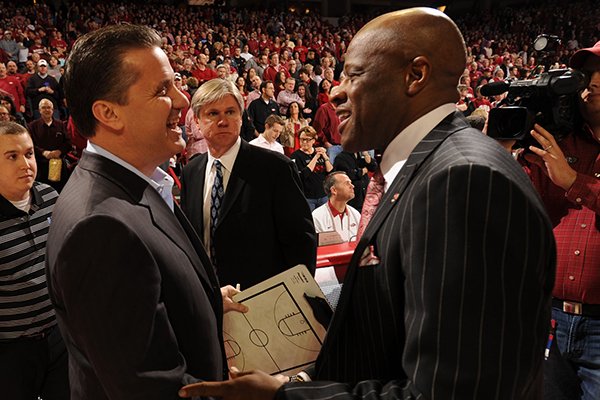 Kentucky coach John Calipari, left, and Arkansas coach Mike Anderson shake hands prior to a March 2, 2013 game at Bud Walton Arena in Fayetteville. 