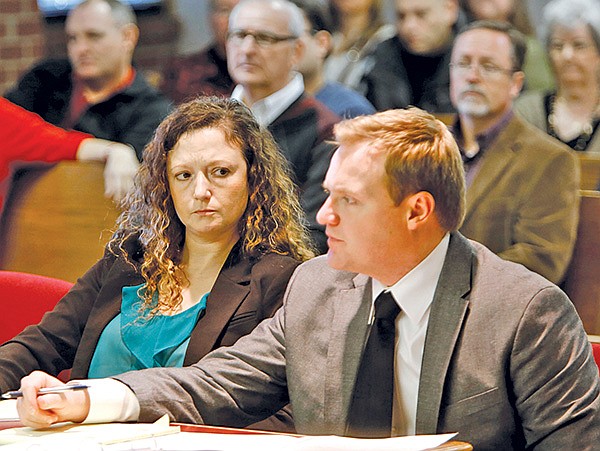 STAFF PHOTO DAVID GOTTSCHALK 
Heather Carlene Swain, left, one of four Prairie Grove residents charged in the beating death of Ronnie Lee Bradley, sits with her attorney Tyler Benson on Monday in a courtroom at the Washington County Courthouse in Fayetteville.