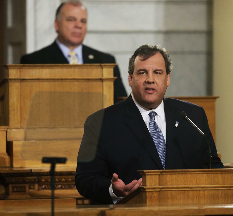 New Jersey Gov. Chris Christie delivers his State of the State address Tuesday at the Statehouse in Trenton, N.J., as New Jersey Senate President Stephen Sweeney listens. 