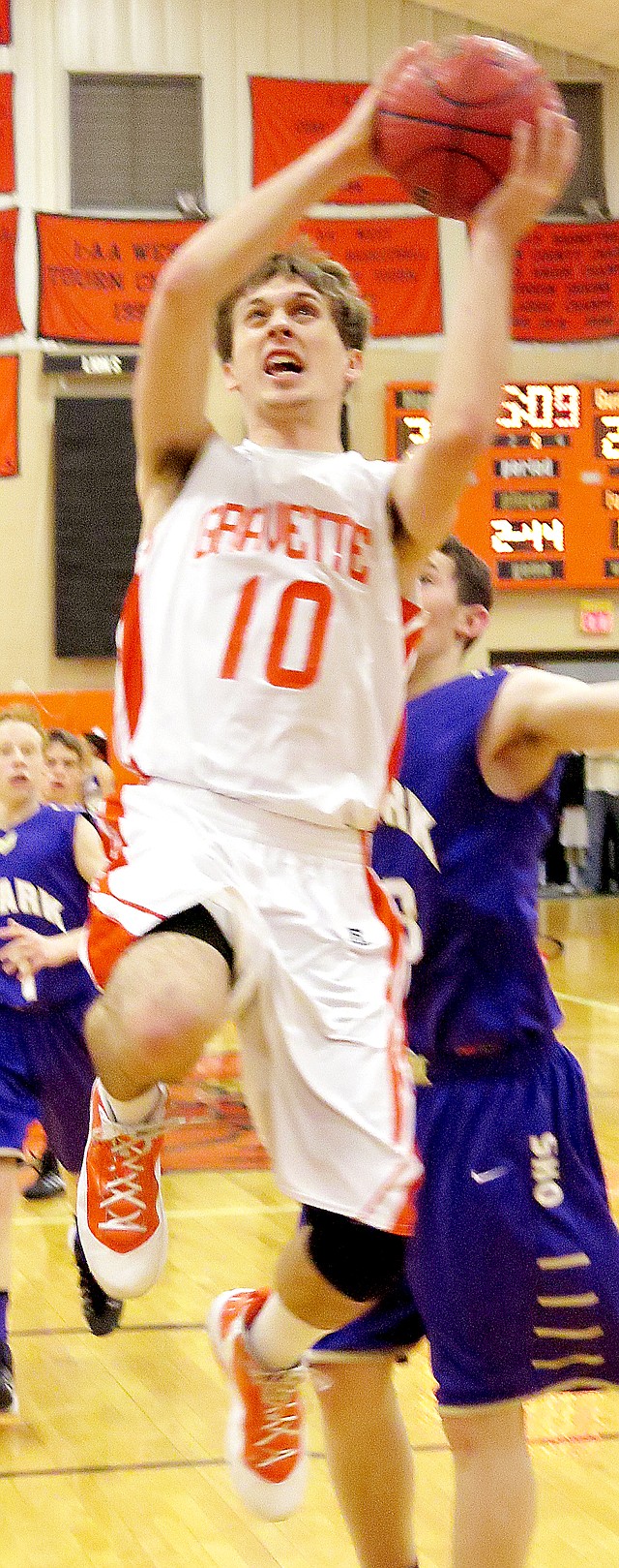 Photo by Randy Moll Gravette senior, Terence Pierce, goes up for two below the basket in the game against Ozark at Gravette on Friday.