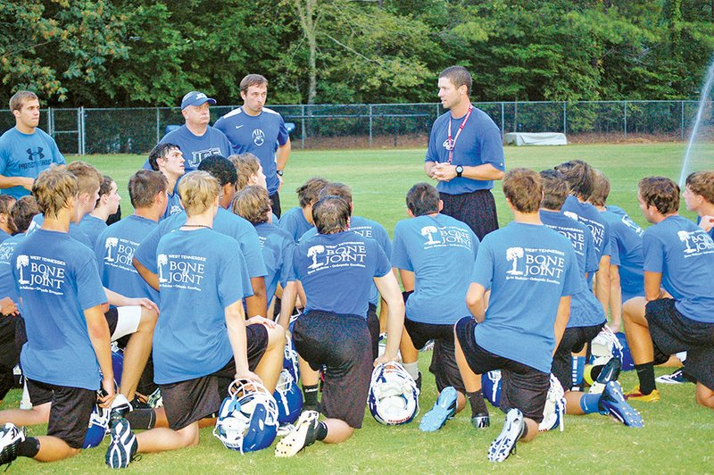 New Harding University co-offensive coordinator Matt Underwood talks to Jackson Christian School’s football team after a scrimmage game in Jackson, Tenn., where he has been the head football coach since 2009. Underwood is a Harding University alumnus and said looks forward to his new job.