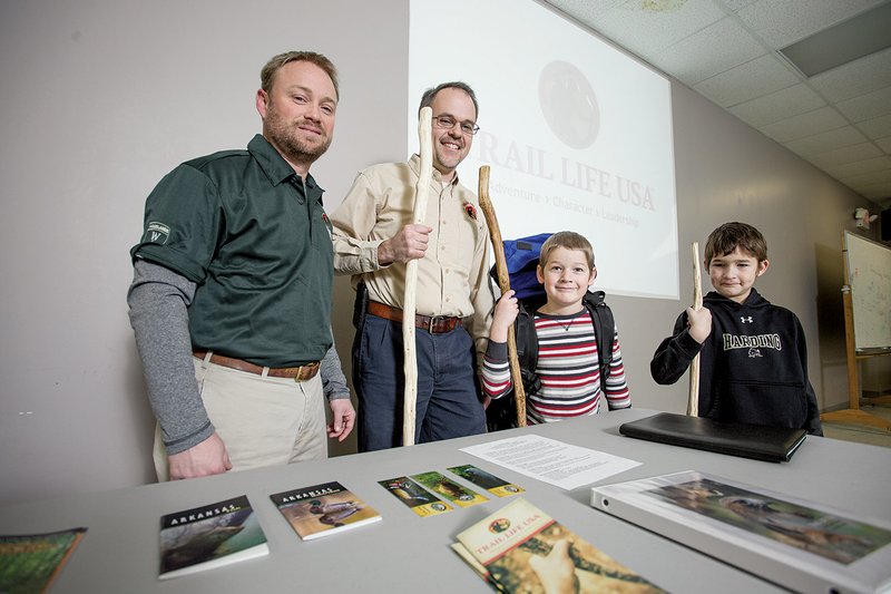 Committee Chairman James Mulvany, from the left, with Eric Bond, troop master for Trail Life USA’s Troop 226 in Searcy, pose with Trailmen Josiah and Jackson Lillard in the meeting room for Trail Life USA.