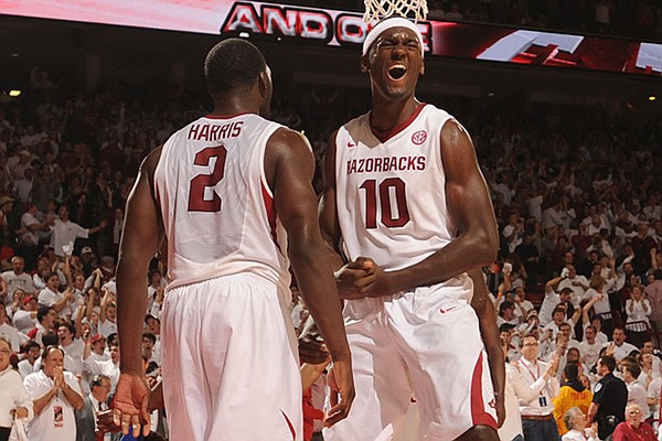 Arkansas forward Alandise Harris, left, celebrates with forward Bobby Portis (10) after Harris scored a basket in the closing moments of the second half of play Tuesday, Jan. 14, 2014, in Bud Walton Arena in Fayetteville.