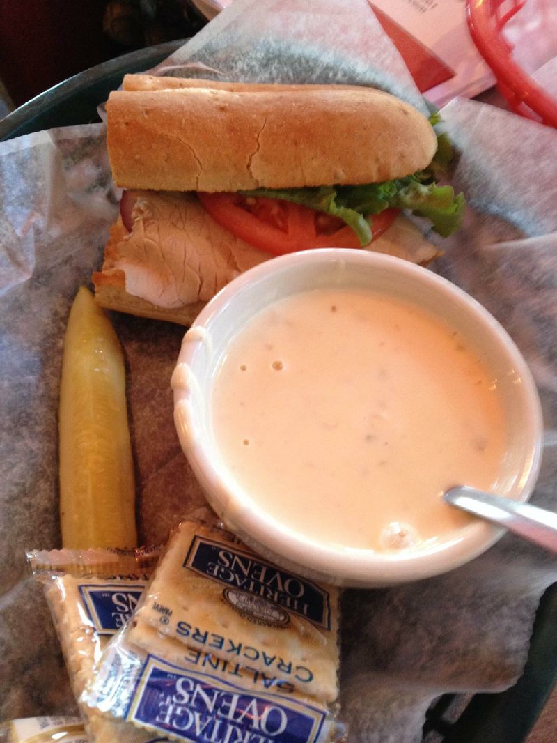 The soup (cup of pepper Jack chicken) and half-sandwich (El Diablo) combo saves money at EJ’s Eats & Drinks. 