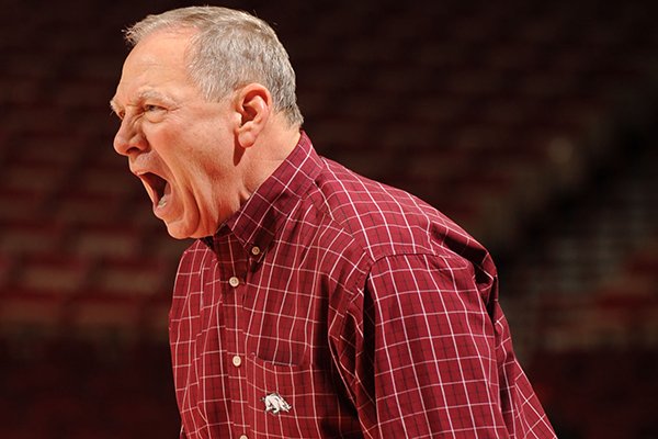 Arkansas coach Tom Collen directs his players during the second half of play against Mississippi State Sunday, Jan. 12, 2014, in Bud Walton Arena in Fayetteville.