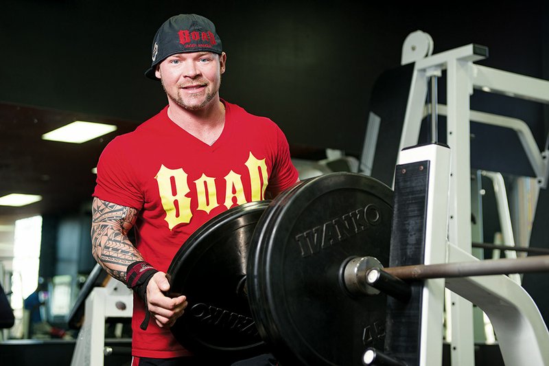 Phillip Brewer gets ready to lift weights at 365 Fitness in Conway, where he trains four to five days a week. Brewer, 34, holds several world records in the bench press and has competed in 20 states and in Russia. He is also a former bodybuilder.