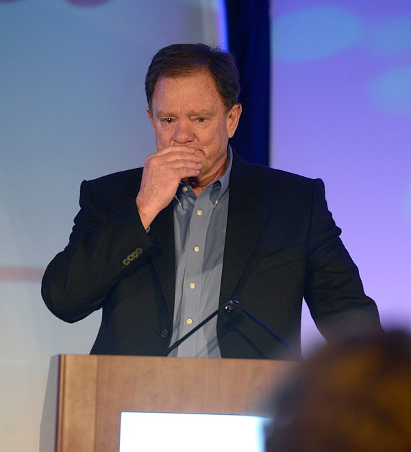 Chris Weiser becomes emotional after receiving the 2014 Civic Service Award Friday, Jan. 17, 2014 at the Springdale Chamber of Commerce luncheon in the Northwest Arkansas Convention Center in Springdale. Weiser award was one of a few given at the luncheon as well as hearing from guest speaker Rob O'Neill, a veteran with the Navy's Seal Team 6.