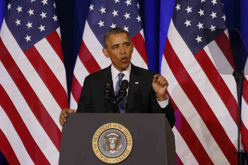 In this Jan. 17, 2014, photo, President Barack Obama Talks about National Security Agency surveillance at the Justice Department in Washington. Obamas orders to change some U.S. surveillance practices put the burden on Congress to deal with a national security controversy that has alarmed Americans and outraged foreign allies. (AP Photo/Charles Dharapak)