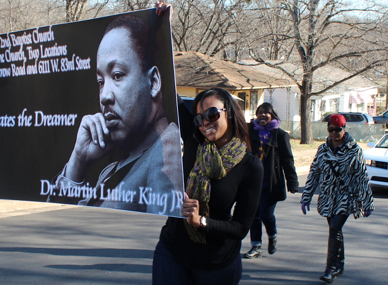 Terri Porter with Second Baptist Church in Little Rock walks with church members in the Martin Luther King Jr. Day march-parade Monday in Little Rock.