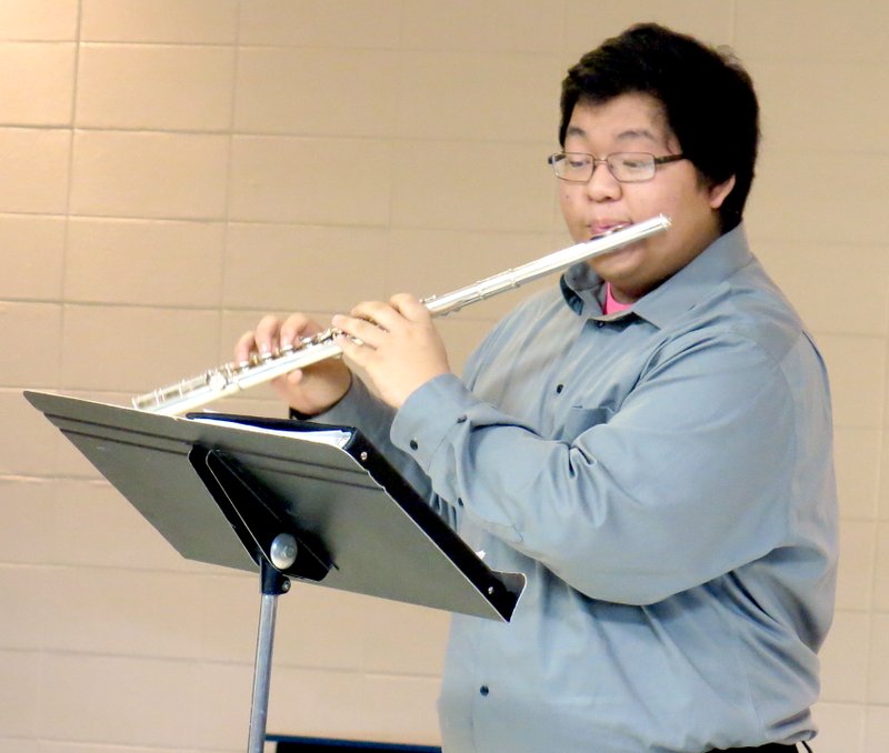 Photo by Mike Eckels Ger Vang, senior high school band student seen here in concert during the Decatur Christmas Festival in December, won first chair, first band, in the flute during all-region band tryouts. Vang will audition for the all-state band competition on Feb. 8 at ASU in Jonesboro.