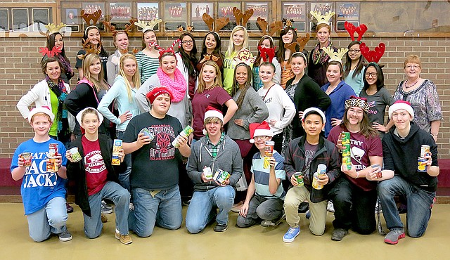 Photo by Randy Moll In addition to presenting a Christmas musical, Gentry Middle and High School choir members collected 356 cans of food for the local food pantry managed by the First Christian Church in Gentry.