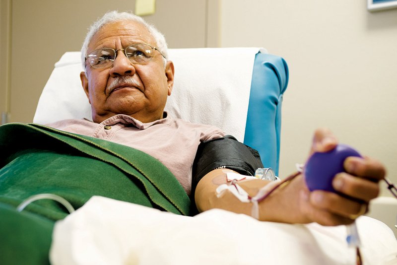 Mackie Cruz of Saline County donates blood at the Red Cross donation center in Little Rock on Jan. 16.
