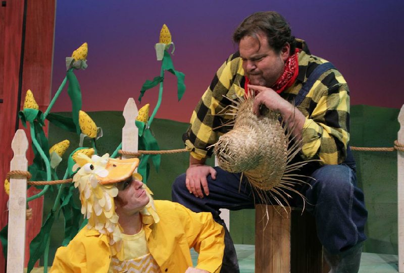 Jeremy Matthey plays Duck with John Isner as Farmer Brown in Click, Clack, Moo: Cows That Type at the Arkansas Arts Center Children’s Theatre. 
