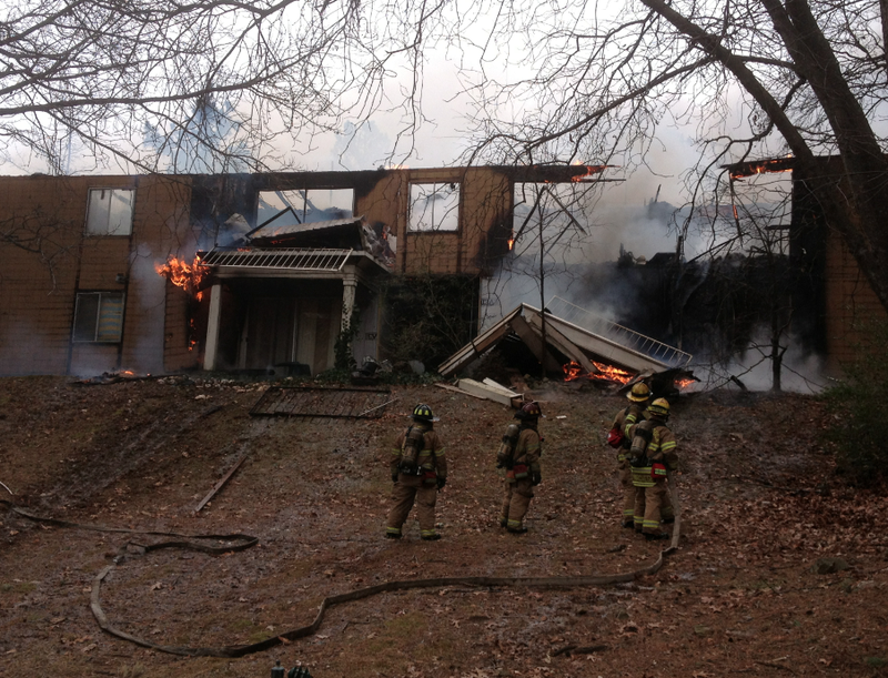 A fire burns at the Out-In-The Woods Apartments on Kanis Road in Little Rock on Thursday, Jan. 23, 2014.