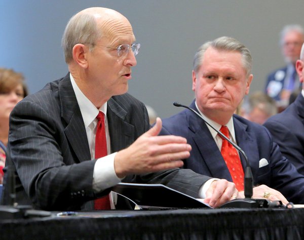 University of Arkansas Fayetteville Chancellor David Gearhart, right, listens as Don Pederson, UA Vice Chancellor for Finance and Administration, addresses the UA Board of Trustees Audit Committee meeting Thursday at UAMS in Little Rock.