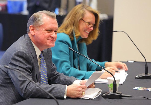 1/24/14
Arkansas Democrat-Gazette/STEPHEN B. THORNTON
University of Arkansas Fayetteville Chancellor David Gearhart, left, and Sharon Gaber, UA Provost and Vice Chancellor, smile as they   address the UA Board of Trustees  meeting Friday at UAMS in Little Rock. 