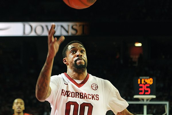 Arkansas' Rashad Madden chases the ball down court to save it Saturday, Jan. 25, 2014, during the second half of the game against Auburn at Bud Walton Arena in Fayetteville.