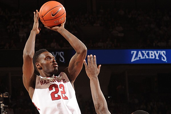 Arkansas forward Jacorey Williams (22) takes a shot over Kentucky forward Julius Randle during the first half of play Tuesday, Jan. 14, 2014, in Bud Walton Arena in Fayetteville.