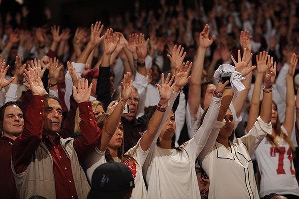 Fans call the Hogs during the first half of play Tuesday, Jan. 14, 2014, in Bud Walton Arena in Fayetteville.