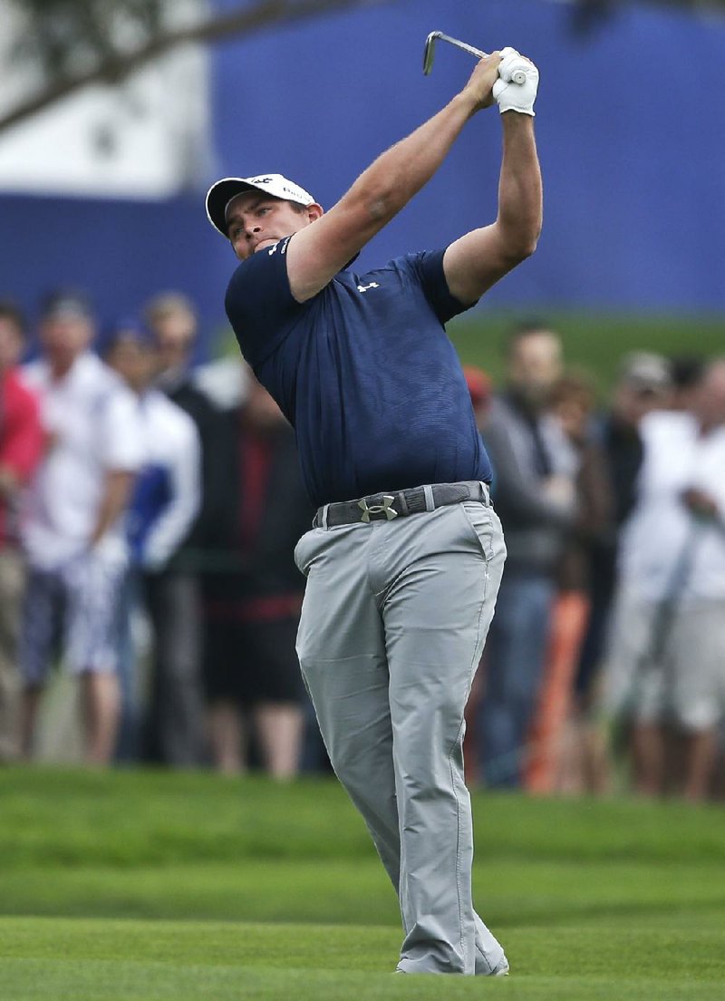 Scott Stallings follows through after a shot on the 18th hole of the South Course at Torrey Pines during the final round of the Farmers Insurance Open golf tournament, Sunday, Jan. 26, 2014, in San Diego. Stallings won the tournament. (AP Photo/Lenny Ignelzi)