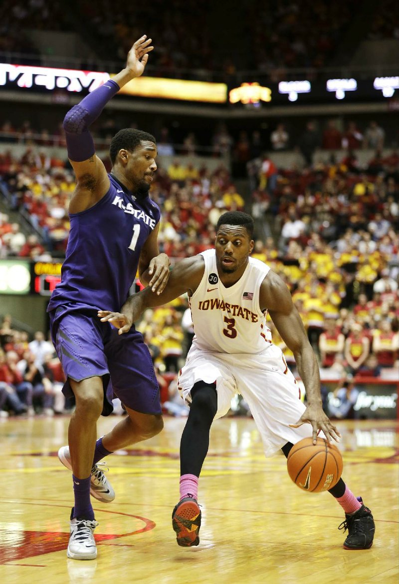 Iowa State forward Melvin Ejim (3) drives to the basket past Kansas State guard Shane Southwell during the second half of the No. 16 Cyclones’ 81-75 victory over the No. 22 Wildcats on Saturday at Hilton Coliseum in Ames, Iowa. Ejim scored 20 points to lead the Cyclones, who broke a three-game losing streak. 