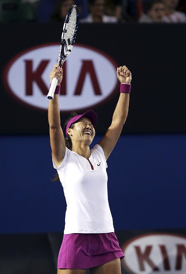 Li Na celebrates after beating Dominika Cibulkova 7-6 (3), 6-0 in the women’s singles final at the Australian Open in Melbourne, Australia. 