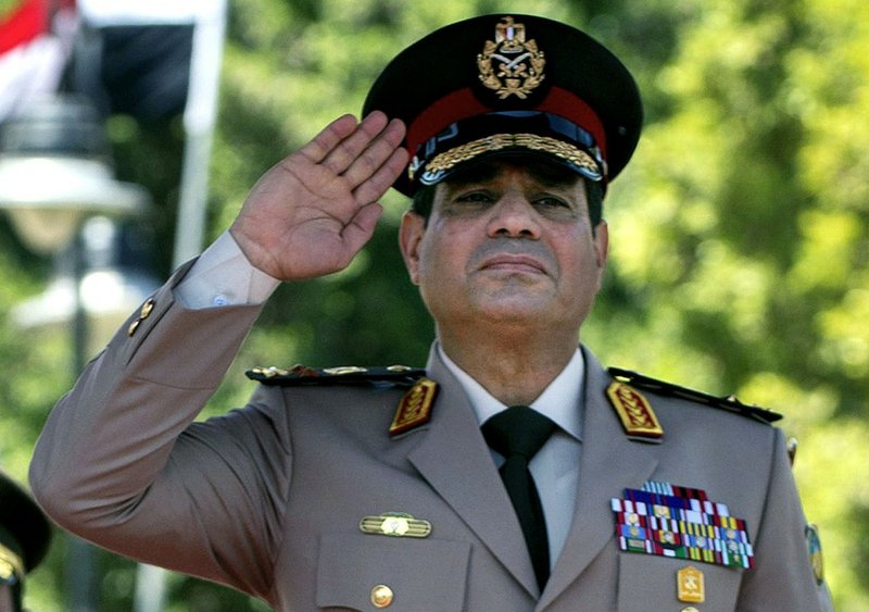 In this Wednesday, April 24, 2013, file photo, Egyptian Defense Minister Gen. Abdel-Fattah el-Sissi salutes during an arrival ceremony for U.S. Secretary of Defense Chuck Hagel at the Ministry of Defense in Cairo. 