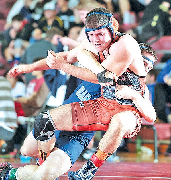 STAFF PHOTO JASON IVESTER 
Douglas Matthews of Springdale Har-Ber works to pin Rogers Heritage's Jordan Vazquez in the 182-pound weight class during the Big West Conference Tournament on Saturday at Springdale High School.