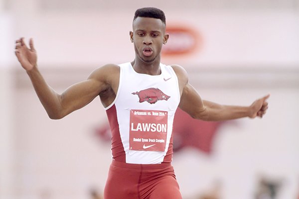 Arkansas sophomore Jarrion Lawson competes in the long jump during a dual meet against Texas on Friday, Jan. 17, 2014, at the Randal Tyson Track Center in Fayetteville.