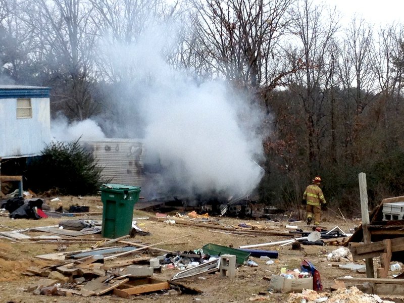 Crews respond Tuesday, Jan. 28, 2014, to a camper fire on Vaughn Road in North Little Rock.