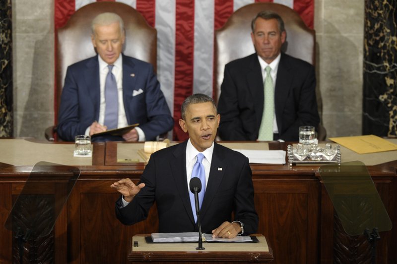 Vice President Joe Biden and House Speaker John Boehner of Ohio listen as President Barack Obama gives his State of the Union address on Capitol Hill in Washington on Tuesday night.