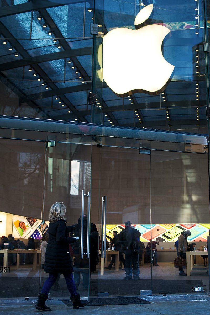 A shopper enters an Apple Inc. store in New York last week. Apple shares fell $44 on Tuesday, the biggest one-day drop in a year, after the company said Monday that it sold fewer iPhones than expected during the Christmas season. 