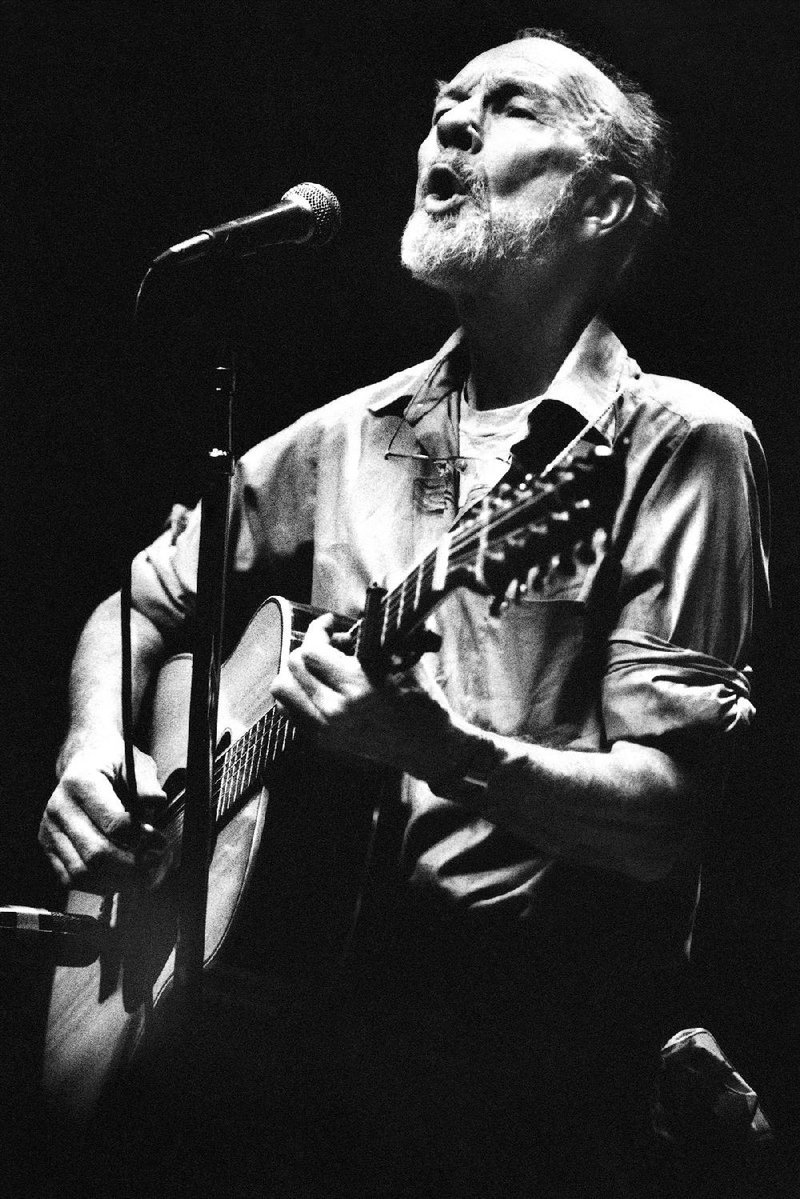 Pete Seeger performs in a one-man benefit concert in Berkeley, Calif., on Feb. 25, 1984. Seeger died Monday at age 94. 