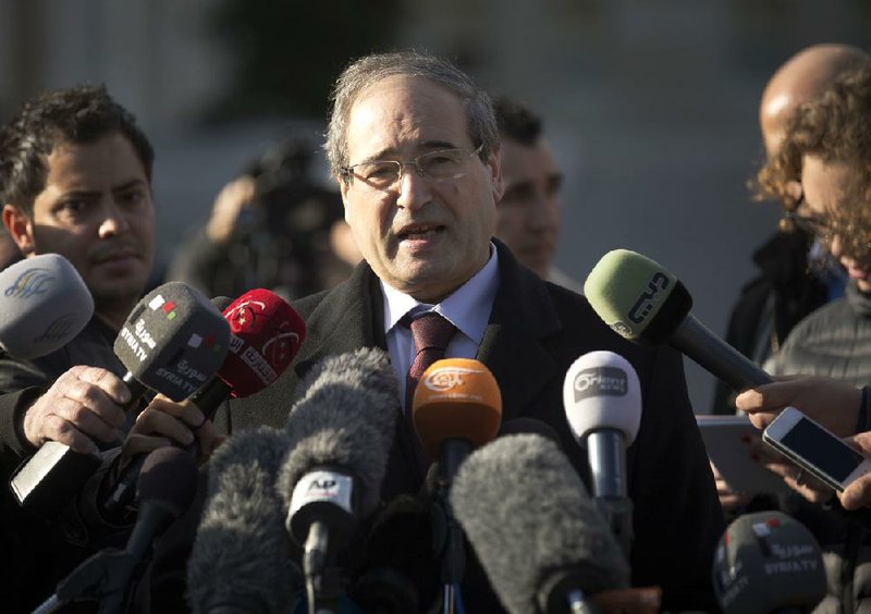 Syrian Deputy Foreign Minister Faisal al-Mikdad speaks after a meeting with the Syrian opposition at the United Nations headquarters in Geneva on Tuesday. 