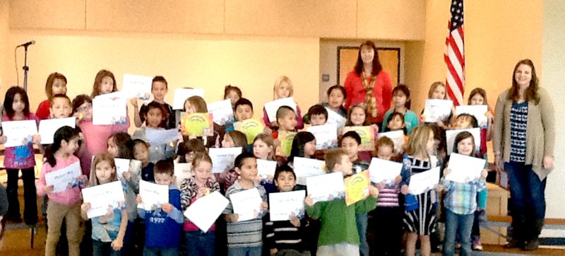 Submitted Photo Members of Decatur Northside Elementary s first grade class display their certificates they received during the honor roll assembly on Jan. 16. In all, 35 first-graders either made the All A s or A-B list for the second quarter.