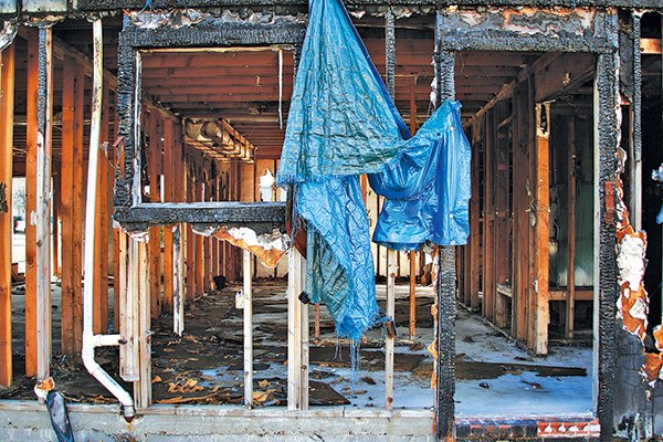 STAFF PHOTO DAN HOLTMEYER 
What’s left of the four-unit apartment building at 546 Betty Jo Drive stands Saturday more than a year and a half after a fire destroyed much of the structure. The building’s owner says finding financing for its renovation has been tougher than expected, but so far no city code has been broken.