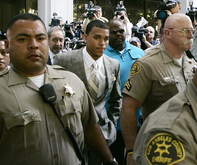 In this June 22, 2009, file photo, Chris Brown leaves his preliminary hearing after pleading guilty to one count of felony assault in Los Angeles County Superior Court. 