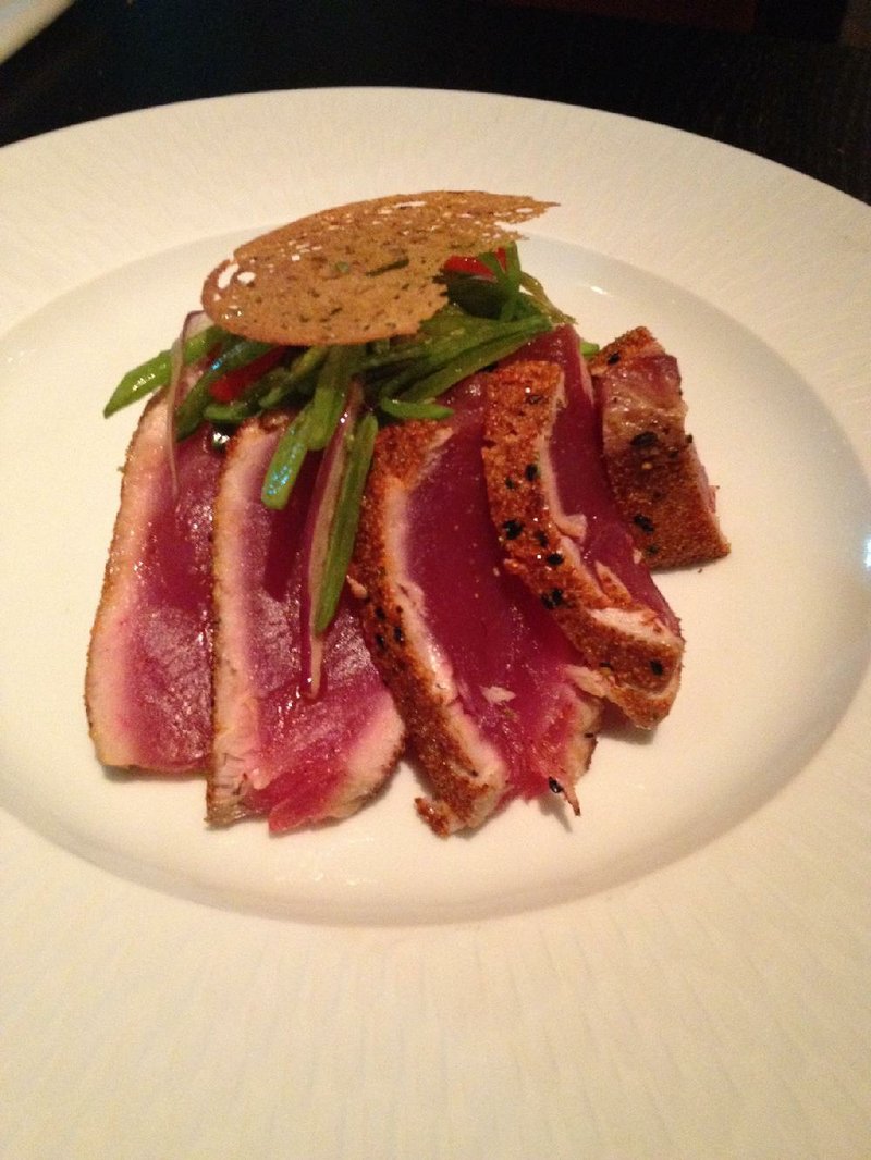 The Spicy Big Eye Tuna plate presentation at Cache drapes mango rice and a sugar-snap salad. 