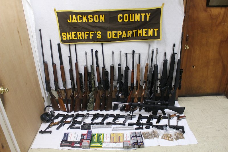 Pictured is a sampling of the several items the Jackson County sheriff's office seized from 69-year-old Donald Bosyter's Newport home on Jan. 14. Jackson County Sheriff David Lucas said investigators were informed that Boyster had intended to sell firearms and related accessories in his possession.