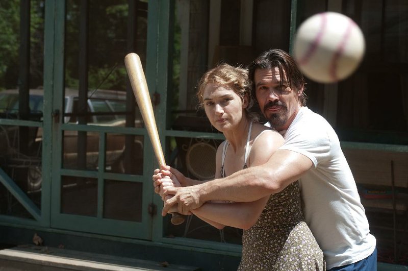 Frank (Josh Brolin) gives Adele (Kate Winslet) some batting instruction in Jason Reitman’s romantic thriller Labor Day. 