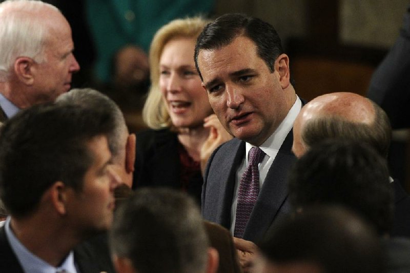 Sen. Ted Cruz, R-Texas, arrives for President Barack Obama's State of the Union address on Capitol Hill in Washington, Tuesday Jan. 28, 2014. (AP Photo/Susan Walsh)