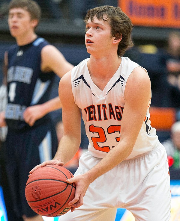 Wyatt Kinnamon of the War Eagles at free throw line against the Wildcats from Har-ber at War Eagle Arena, Rogers Heritage High Shool, Rogers, AR on January 24, 2014